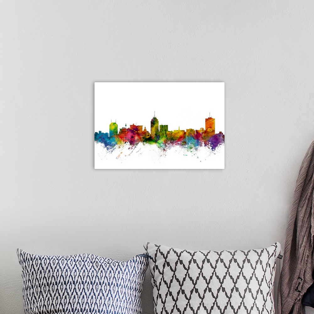 A bohemian room featuring Watercolor artwork of the Fresno skyline against a white background.