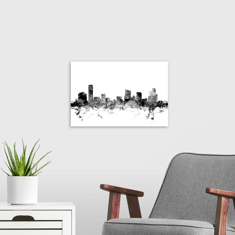 A modern room featuring Contemporary artwork of the Grans Rapids city skyline in black watercolor paint splashes.