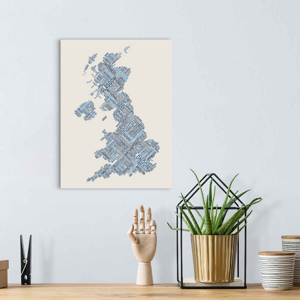 A bohemian room featuring Contemporary piece of artwork of a map of Great Britain made up of the names of the city names.