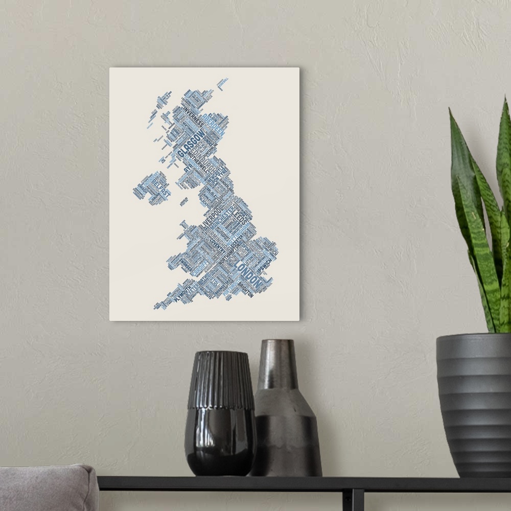 A modern room featuring Contemporary piece of artwork of a map of Great Britain made up of the names of the city names.