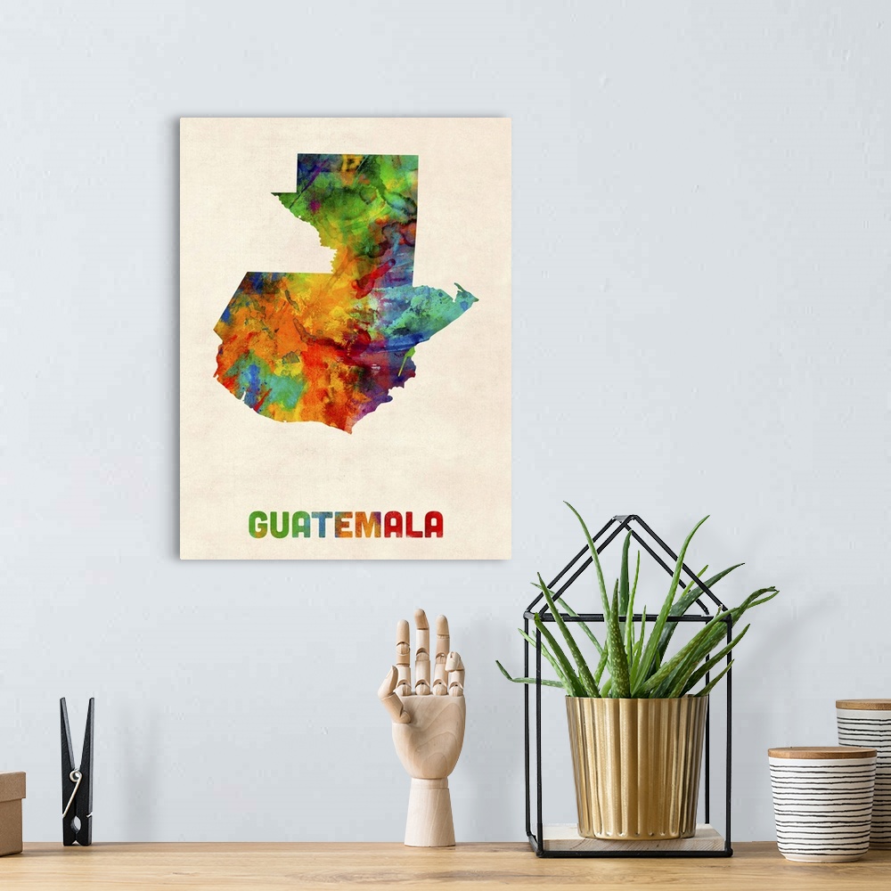 A bohemian room featuring Watercolor art map of the country Guatemala against a weathered beige background.