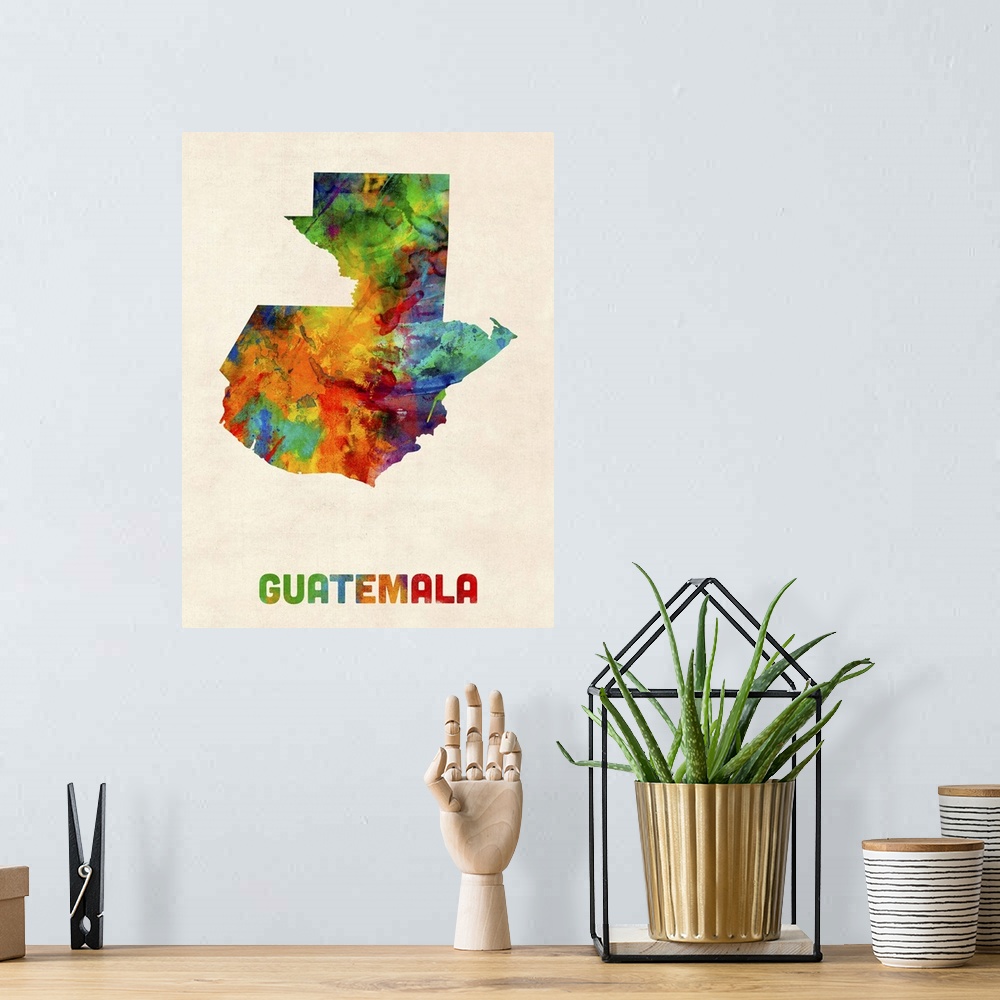 A bohemian room featuring Watercolor art map of the country Guatemala against a weathered beige background.