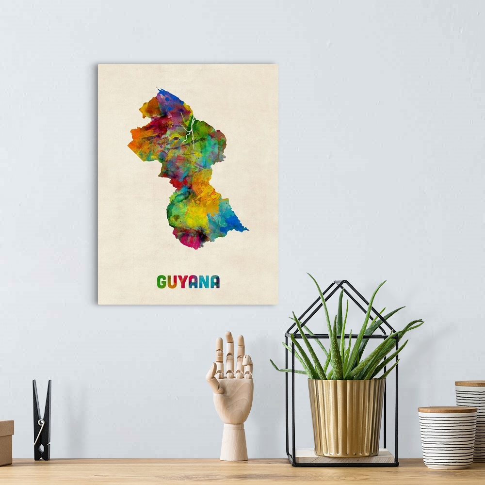 A bohemian room featuring Watercolor art map of the country Guyana against a weathered beige background.