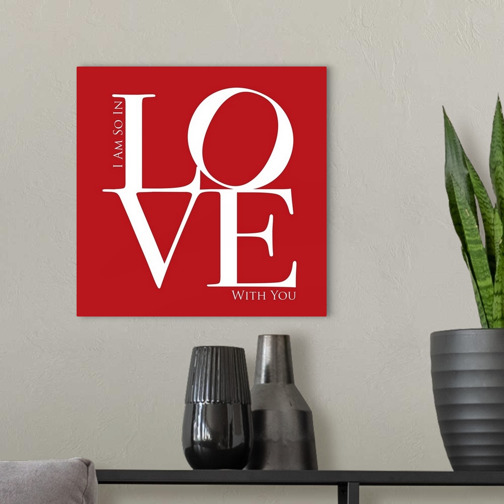 A modern room featuring Square, big wall hanging of typography text art with the words "I am so in LOVE with you" written...