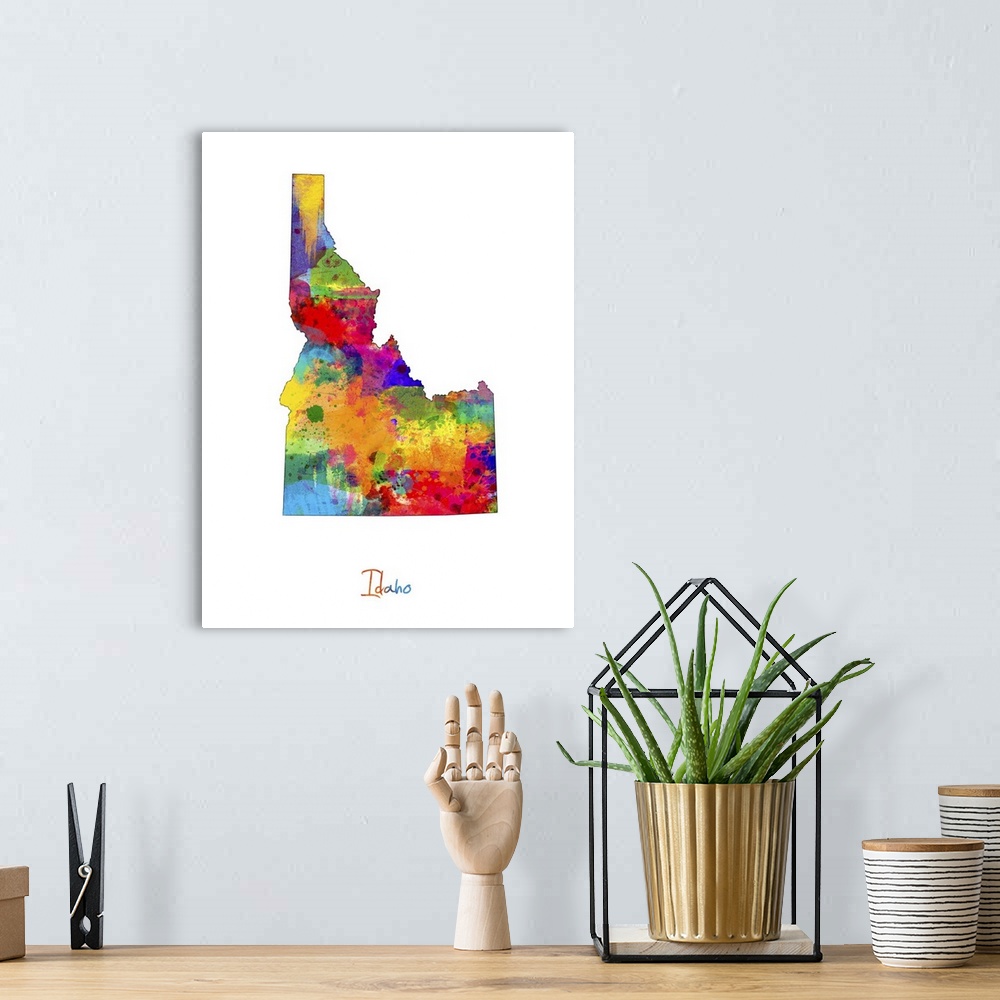 A bohemian room featuring Contemporary artwork of a map of Idaho made of colorful paint splashes.