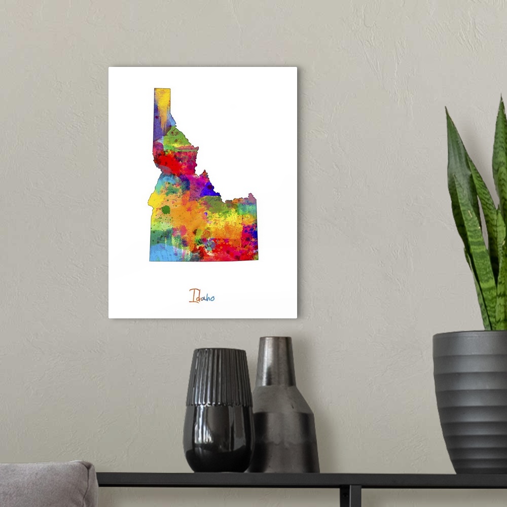 A modern room featuring Contemporary artwork of a map of Idaho made of colorful paint splashes.