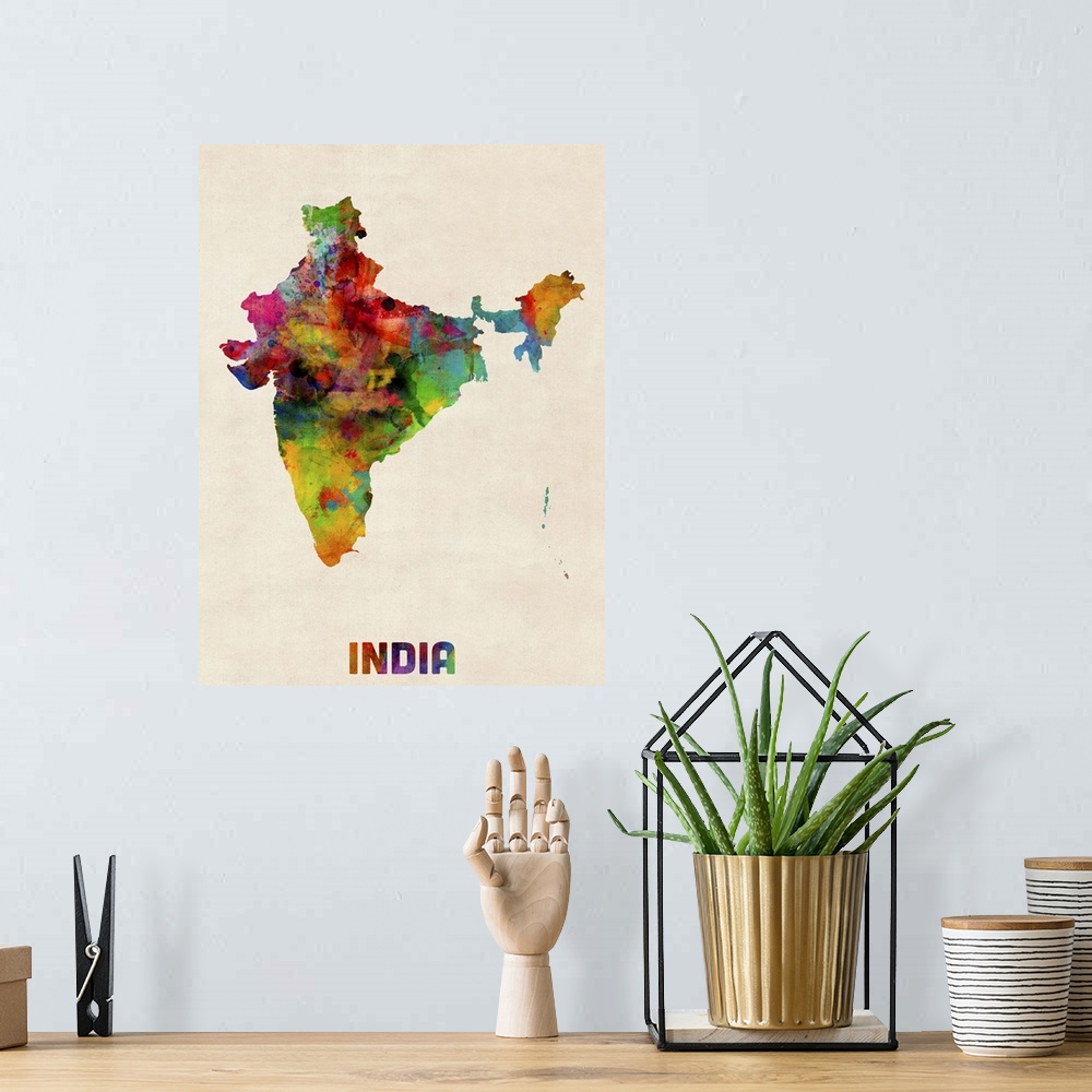 A bohemian room featuring Contemporary piece of artwork of a map of India made up of watercolor splashes.