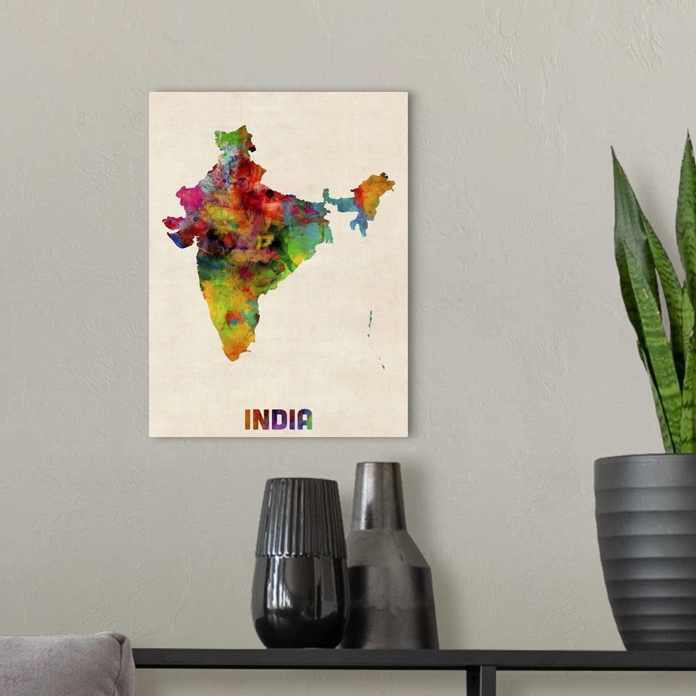 A modern room featuring Contemporary piece of artwork of a map of India made up of watercolor splashes.