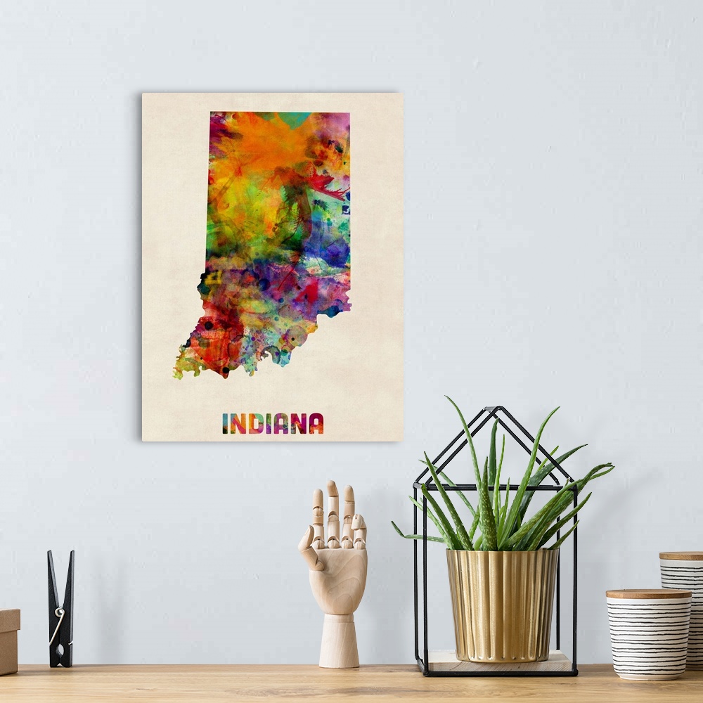 A bohemian room featuring Contemporary piece of artwork of a map of Indiana made up of watercolor splashes.