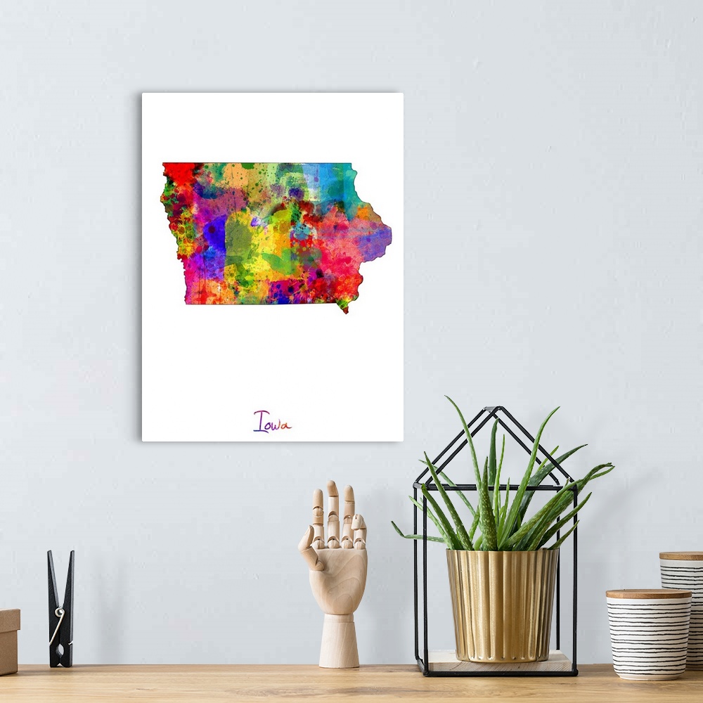 A bohemian room featuring Contemporary artwork of a map of Iowa made of colorful paint splashes.