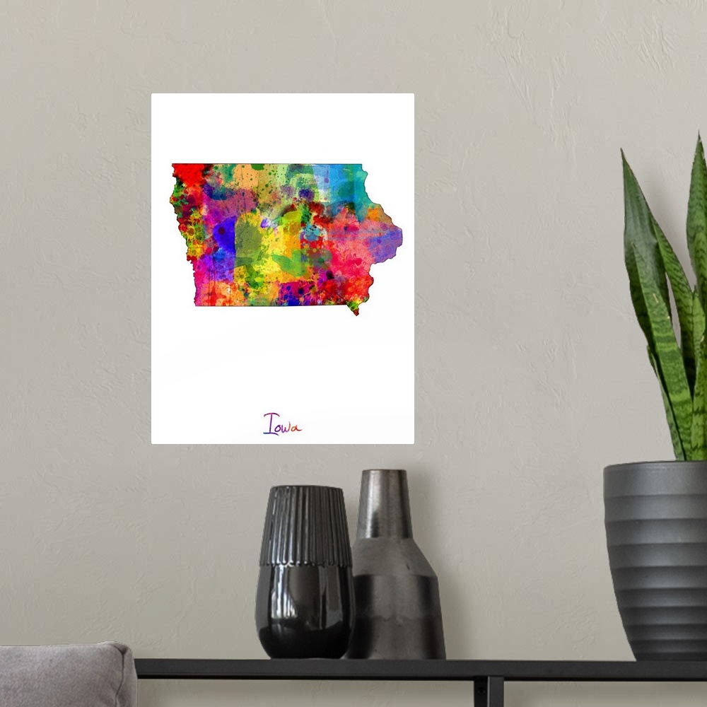 A modern room featuring Contemporary artwork of a map of Iowa made of colorful paint splashes.