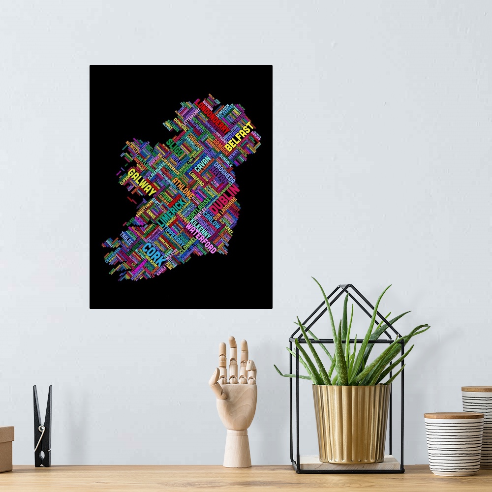 A bohemian room featuring Contemporary piece of artwork of a map of Ireland made up of the names of text.