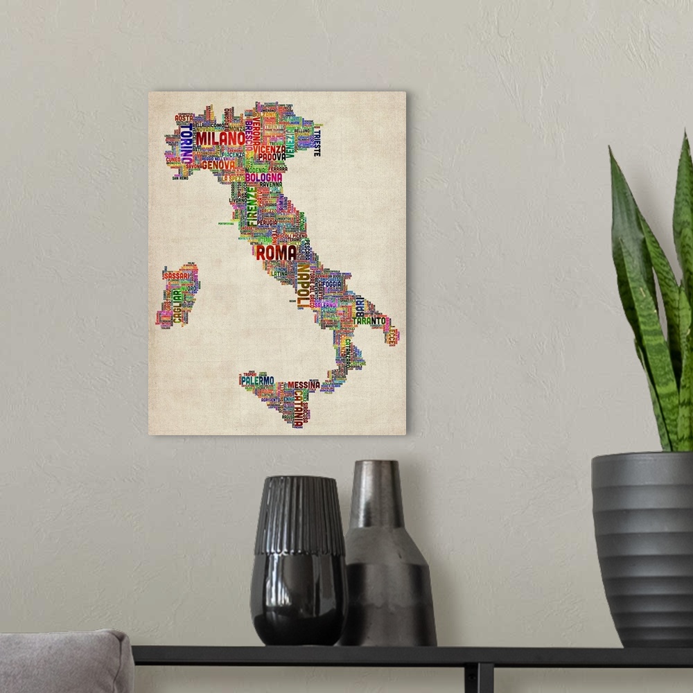 A modern room featuring Typography art depicting the country of Italy composed completely out of the names of cities in a...