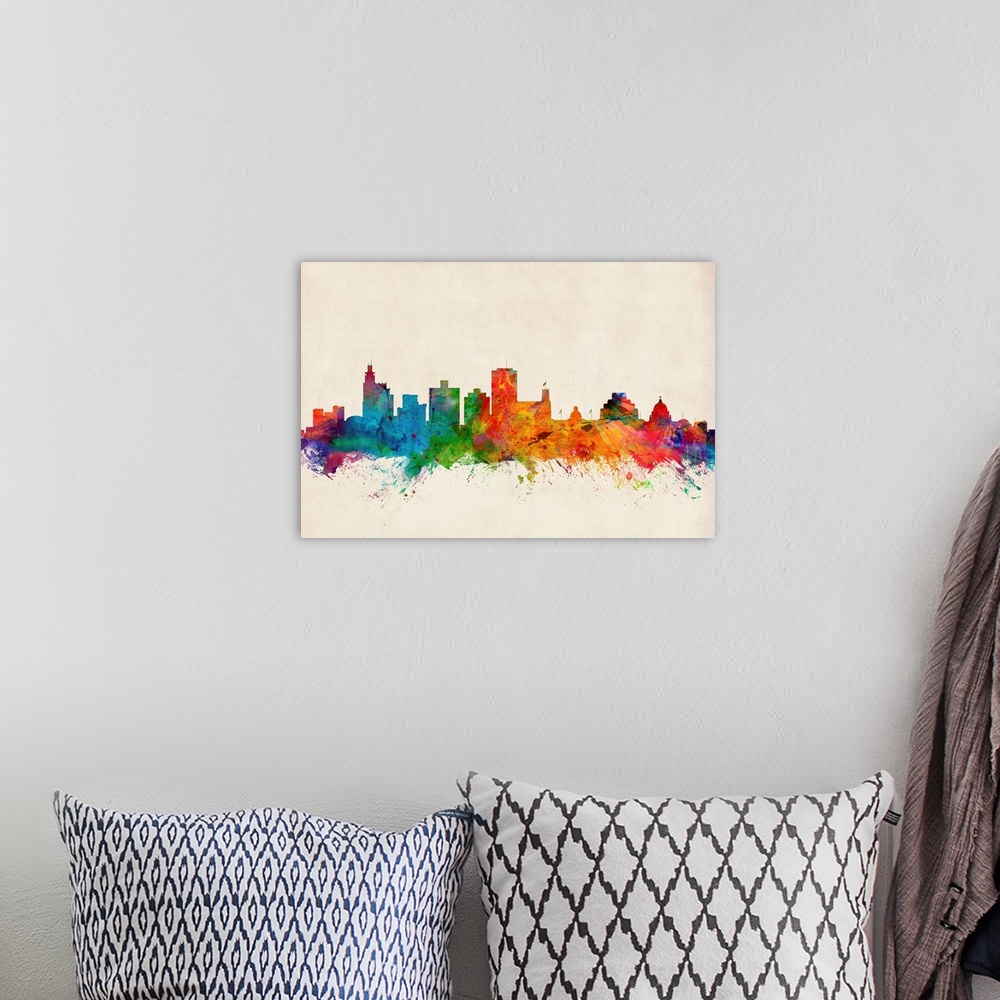 A bohemian room featuring Contemporary piece of artwork of the Jackson skyline made of colorful paint splashes.