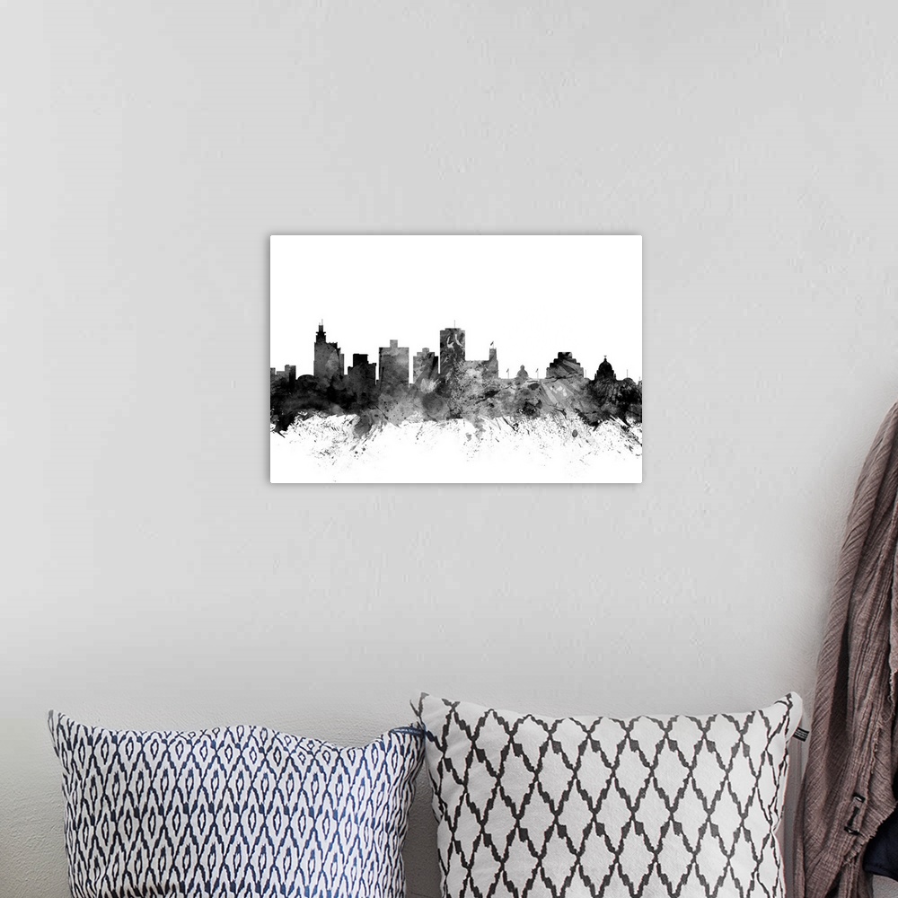 A bohemian room featuring Contemporary artwork of the Jackson city skyline in black watercolor paint splashes.