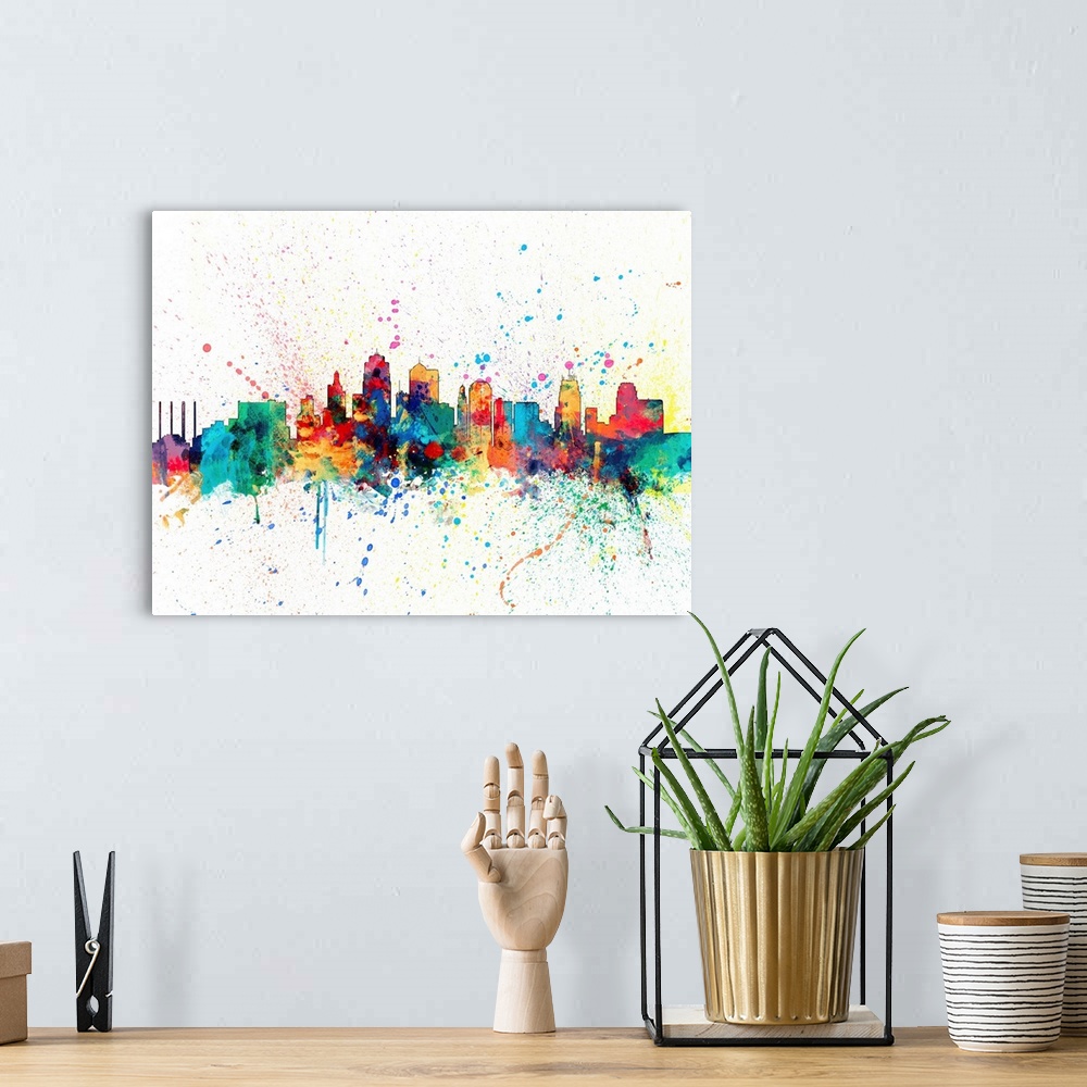 A bohemian room featuring Wild and vibrant paint splatter silhouette of the Kansas skyline.