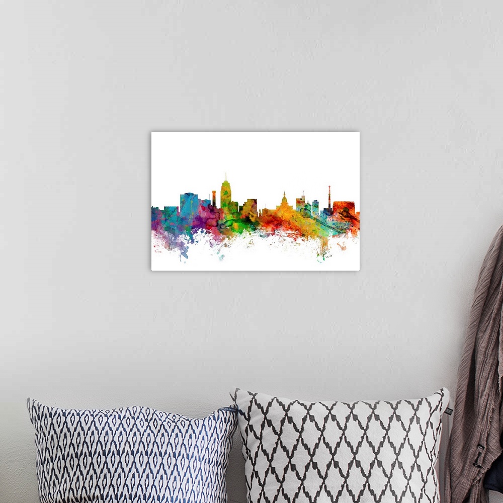 A bohemian room featuring Watercolor artwork of the Lansing skyline against a white background.