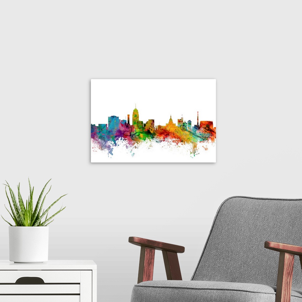 A modern room featuring Watercolor artwork of the Lansing skyline against a white background.