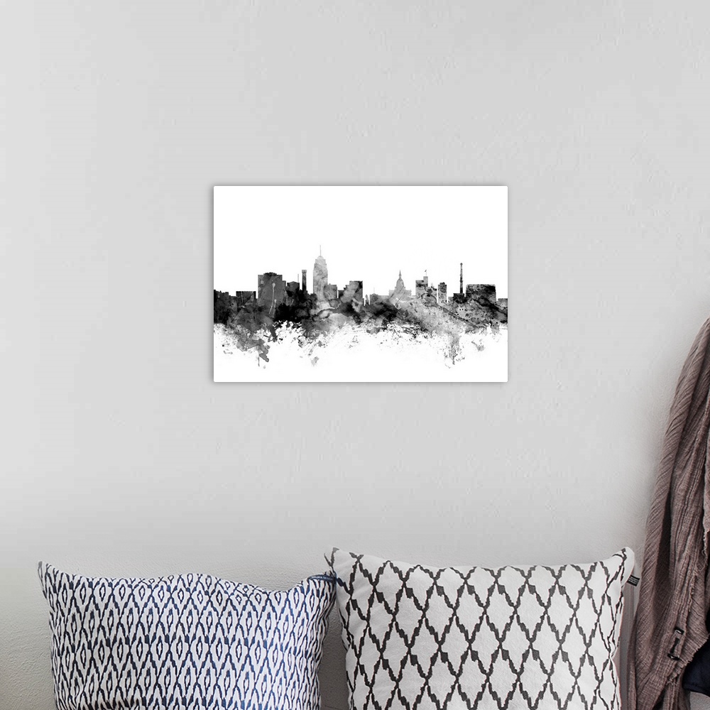 A bohemian room featuring Contemporary artwork of the Lansing city skyline in black watercolor paint splashes.