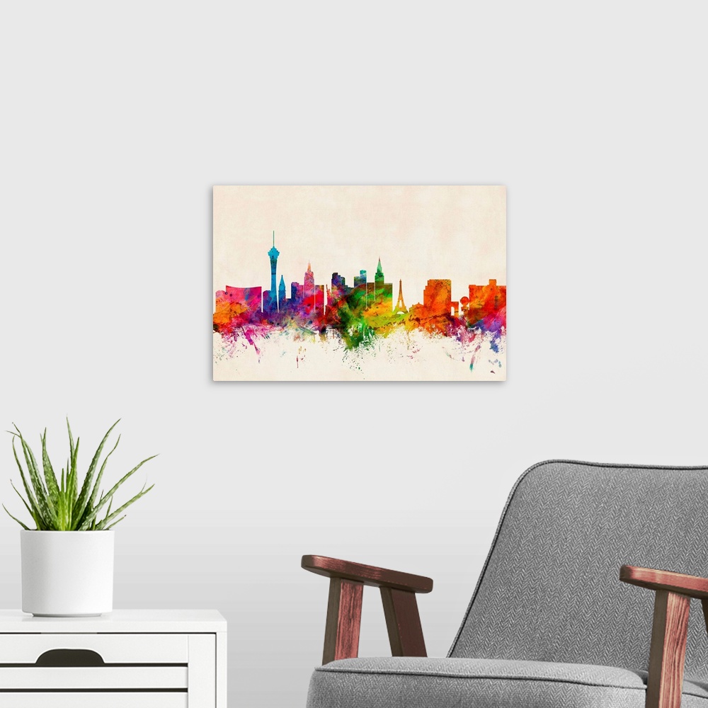 A modern room featuring Contemporary piece of artwork of the Las Vegas skyline made of colorful paint splashes.