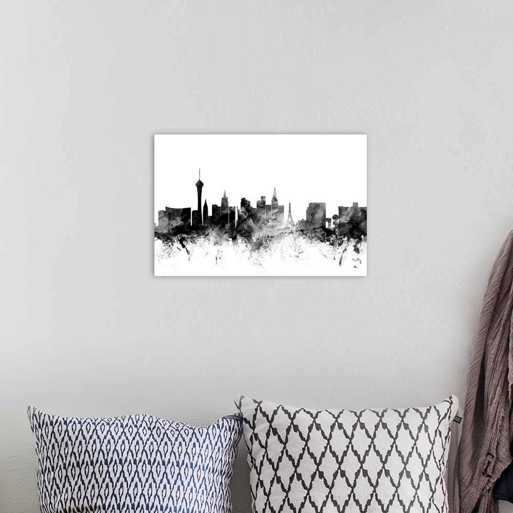 A bohemian room featuring Contemporary artwork of the Las Vegas city skyline in black watercolor paint splashes.