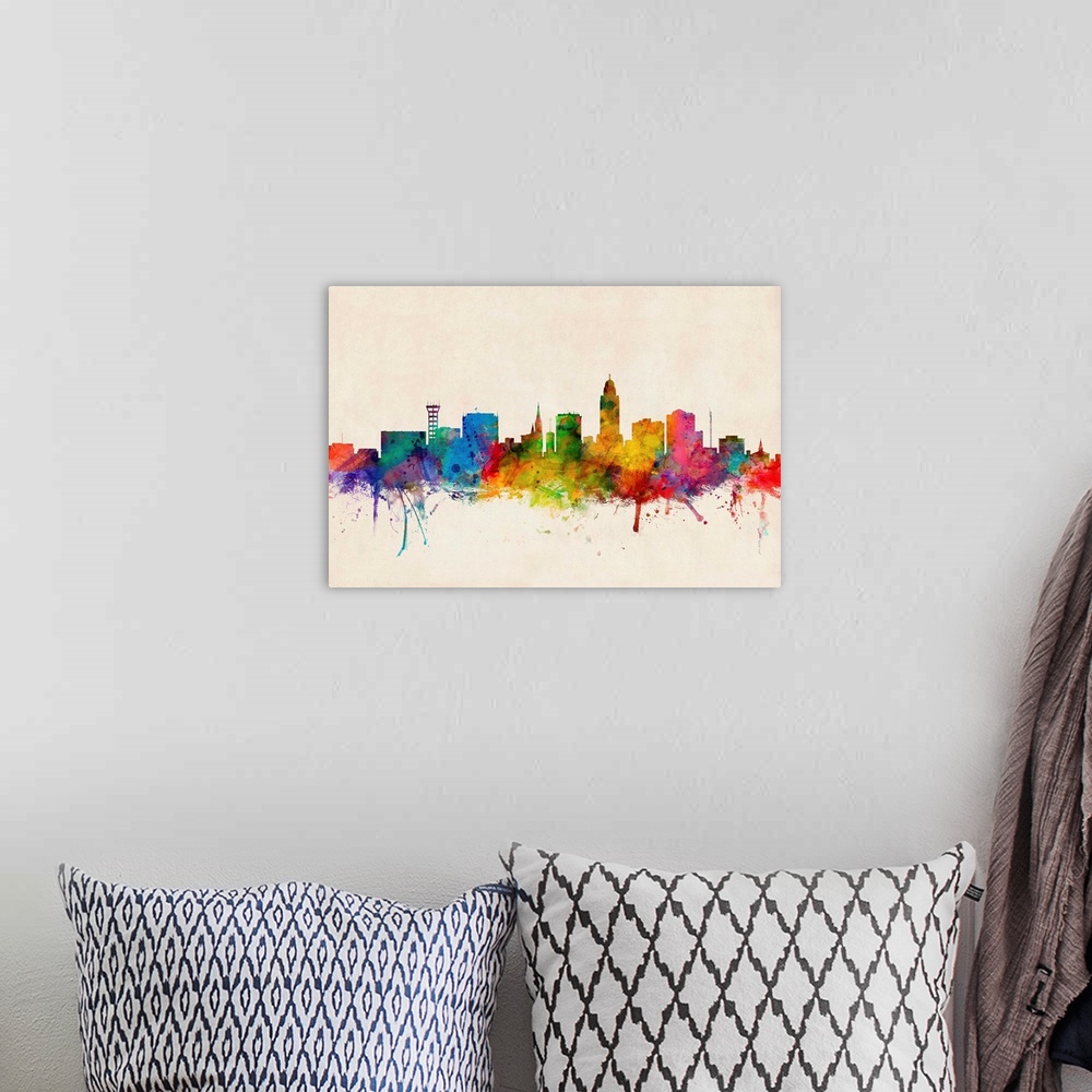 A bohemian room featuring Contemporary piece of artwork of the Lincoln skyline made of colorful paint splashes.