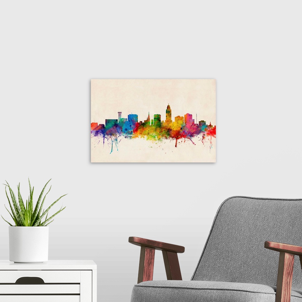 A modern room featuring Contemporary piece of artwork of the Lincoln skyline made of colorful paint splashes.