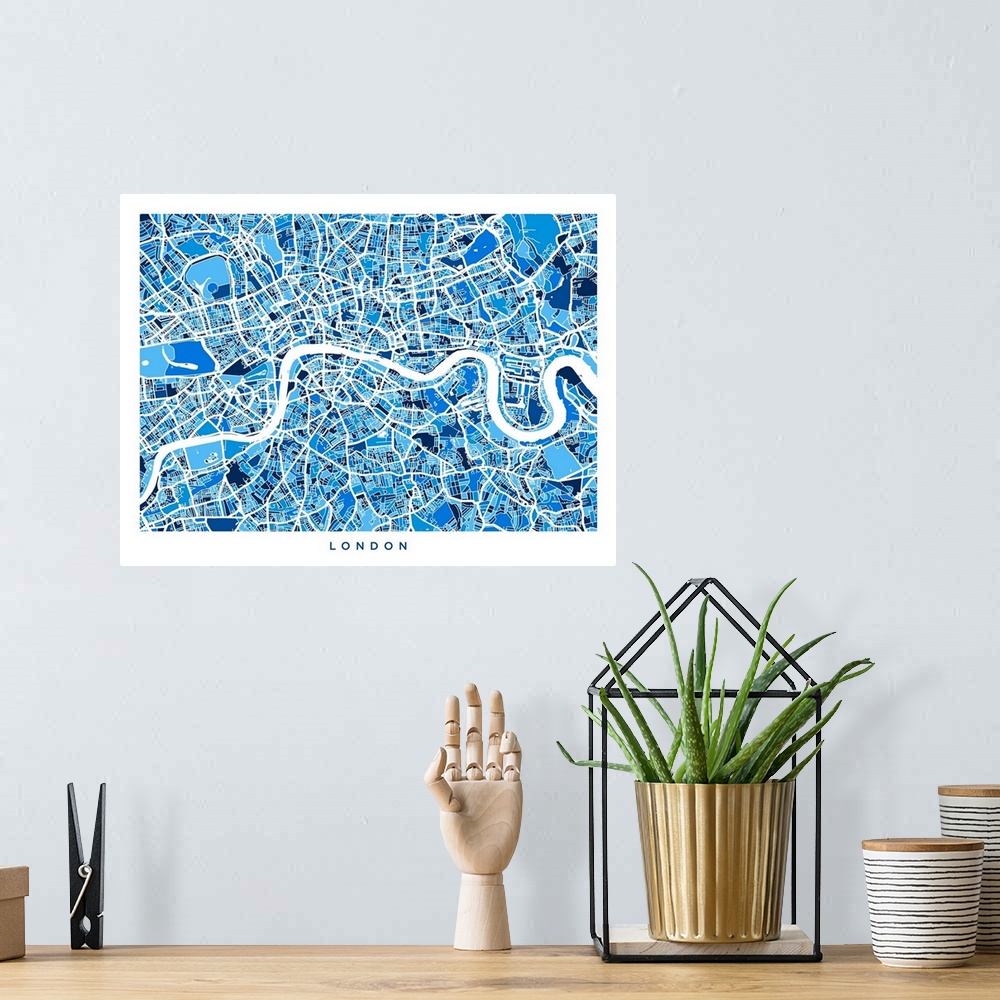 A bohemian room featuring Contemporary artwork of a map of the city streets of London in blue tones.