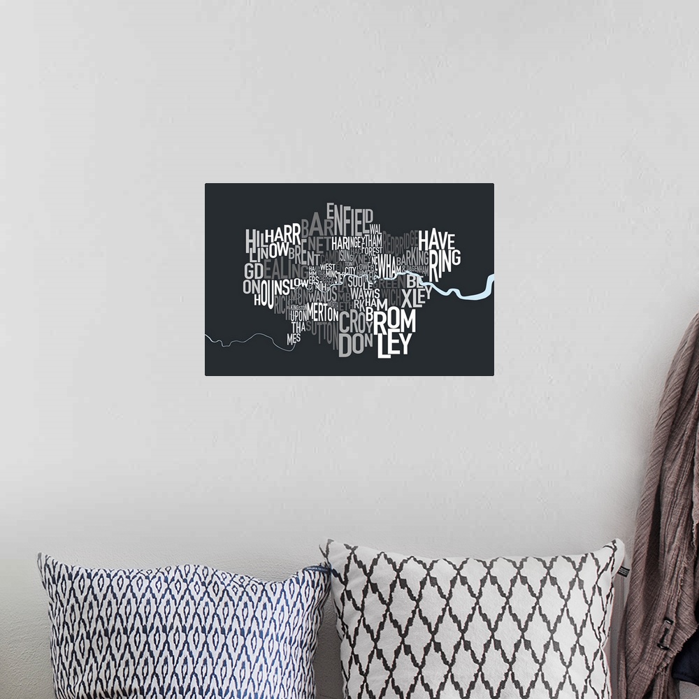 A bohemian room featuring A typographic map of the Boroughs of London, United Kingdom, in shades of grey on a charcoal grey...