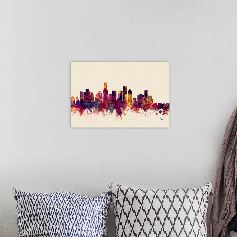 A bohemian room featuring Watercolor artwork of the Los Angeles skyline against a beige background.