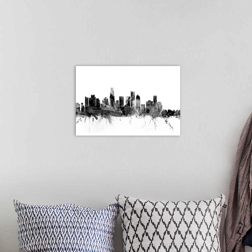 A bohemian room featuring Contemporary artwork of the Los Angeles city skyline in black watercolor paint splashes.