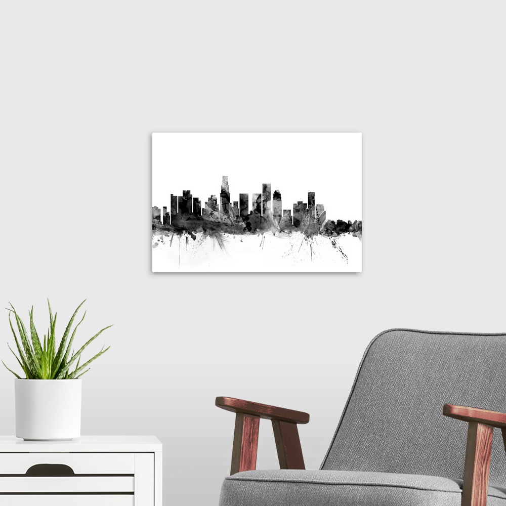 A modern room featuring Contemporary artwork of the Los Angeles city skyline in black watercolor paint splashes.