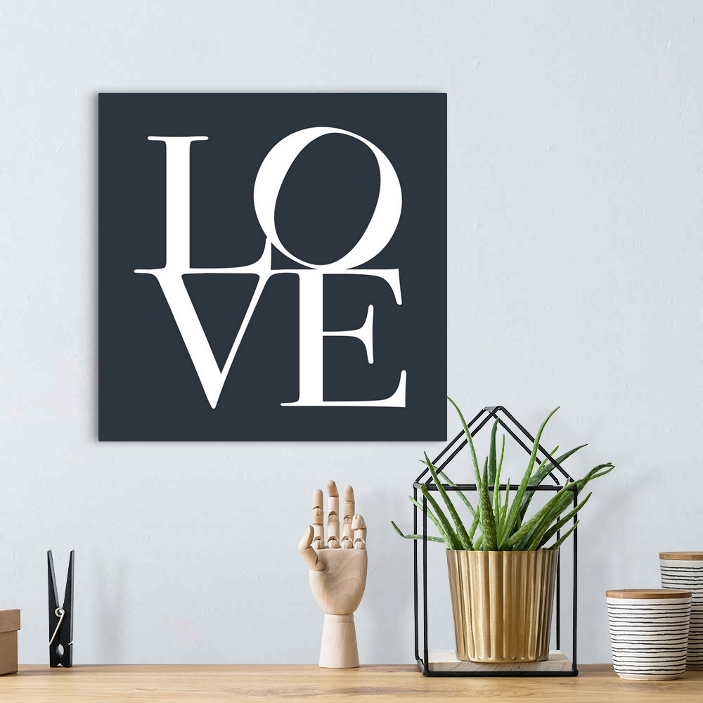 A bohemian room featuring LOVE, typography text art print and canvas print, with the word LOVE written against a slate grey...