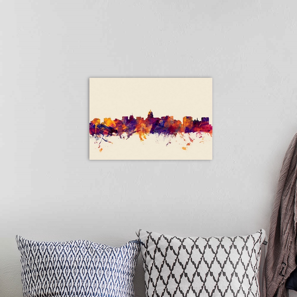 A bohemian room featuring Contemporary artwork of the Madison city skyline in watercolor paint splashes.