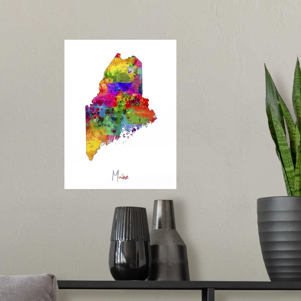 A modern room featuring Contemporary artwork of a map of Maine made of colorful paint splashes.