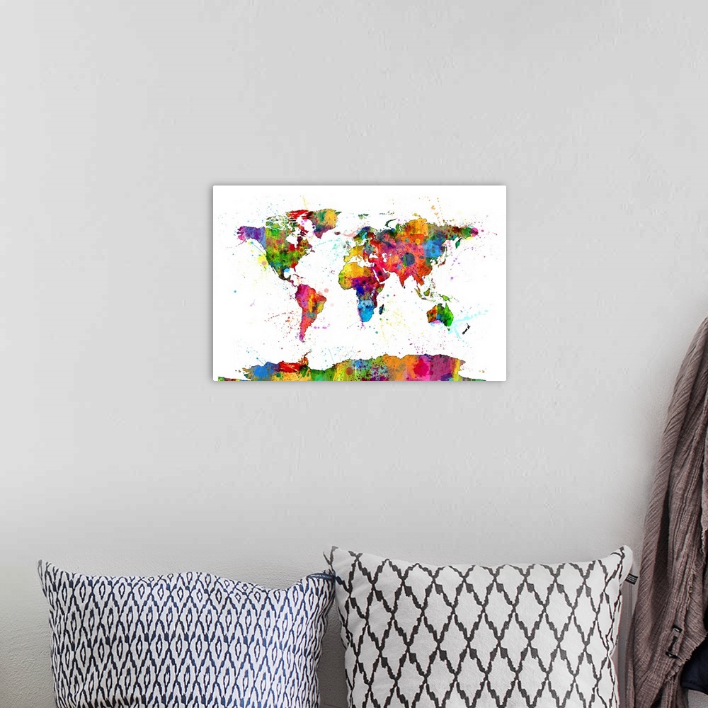 A bohemian room featuring Contemporary piece of artwork of a world map made of colorful paint splashes.