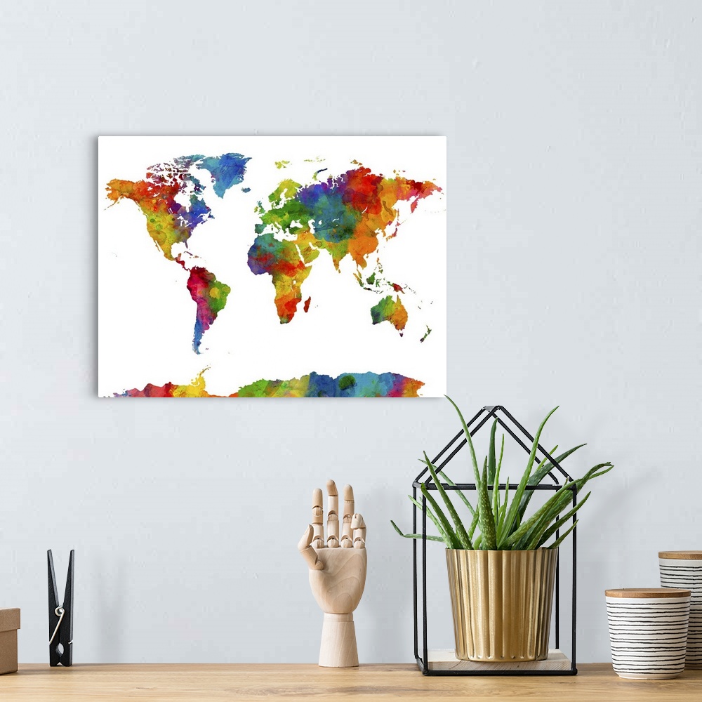 A bohemian room featuring A watercolor art map of the world against a white background.
