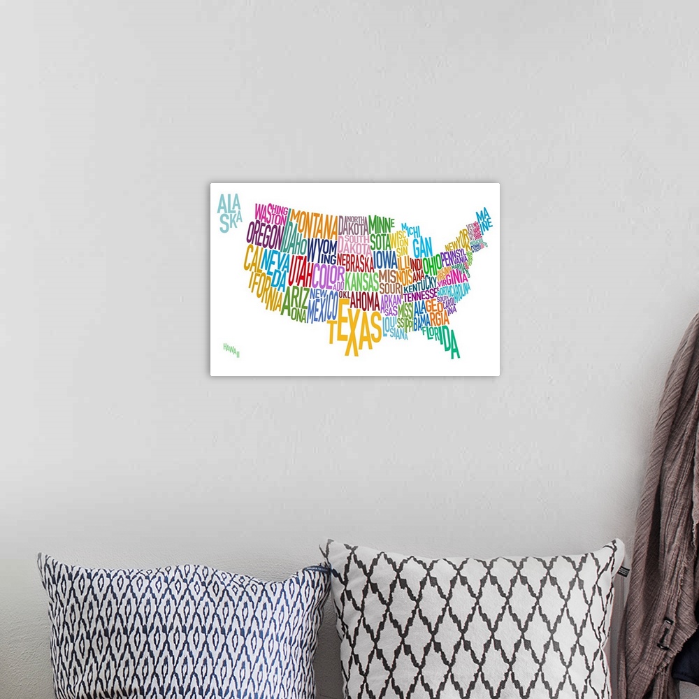 A bohemian room featuring Artwork of the United States that has the name of each state written out as it's shape.