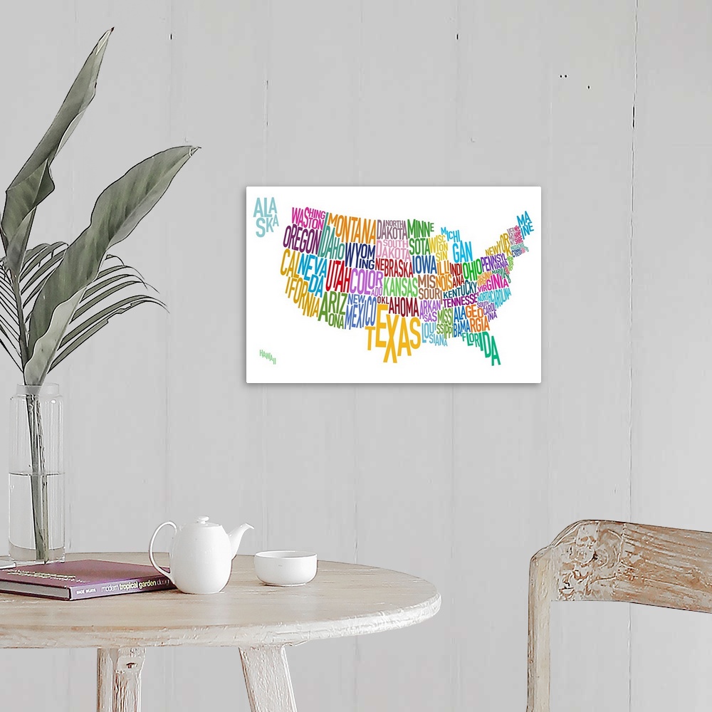 A farmhouse room featuring Artwork of the United States that has the name of each state written out as it's shape.