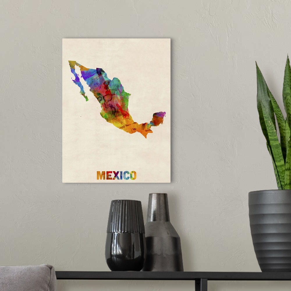 A modern room featuring Contemporary piece of artwork of a map of Mexico made up of watercolor splashes.