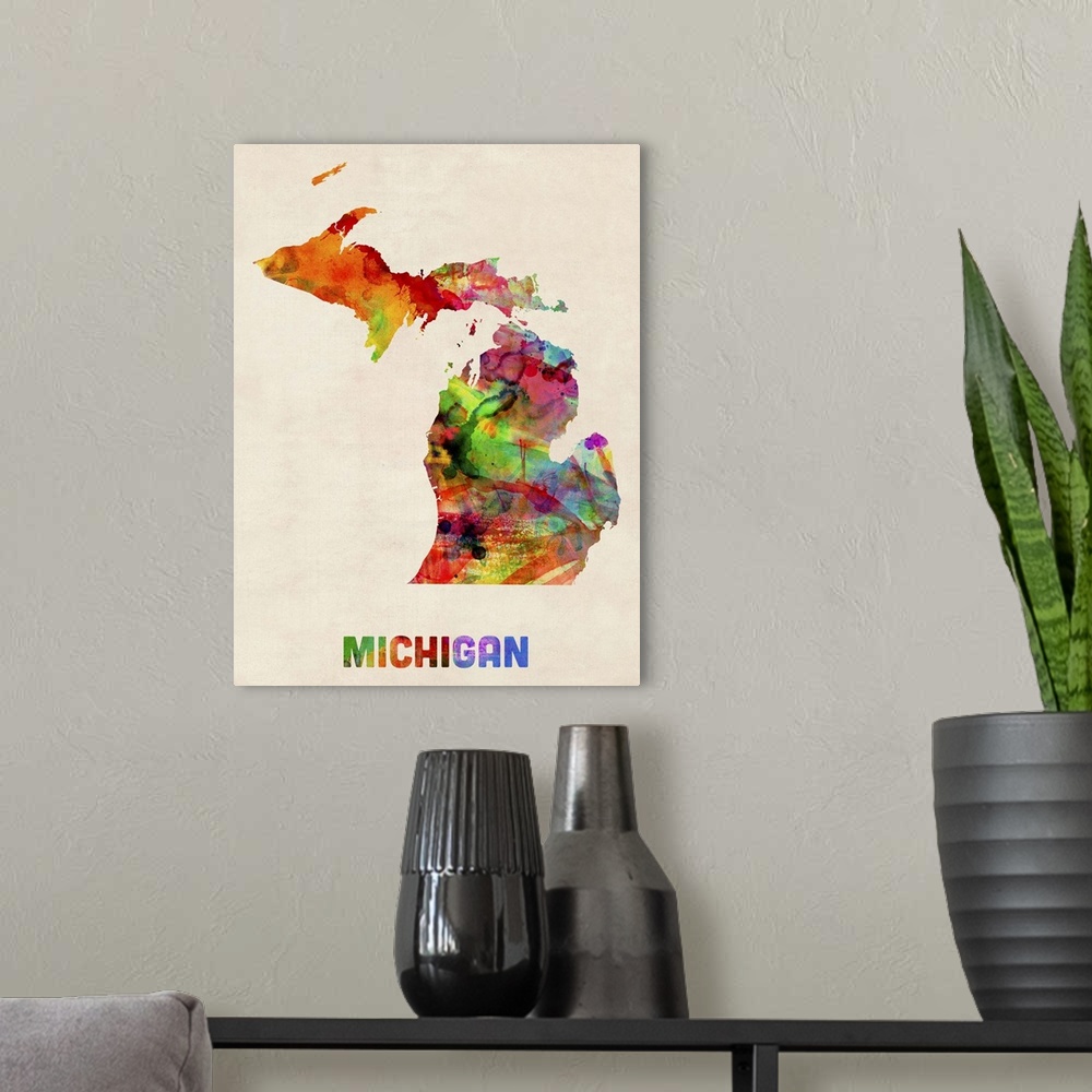 A modern room featuring Contemporary piece of artwork of a map of Michigan made up of watercolor splashes.