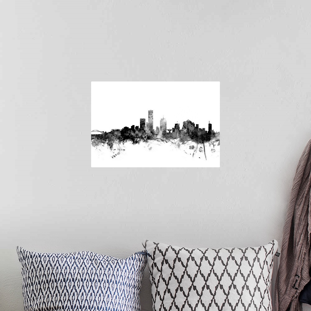 A bohemian room featuring Contemporary artwork of the Milwaukee city skyline in black watercolor paint splashes.
