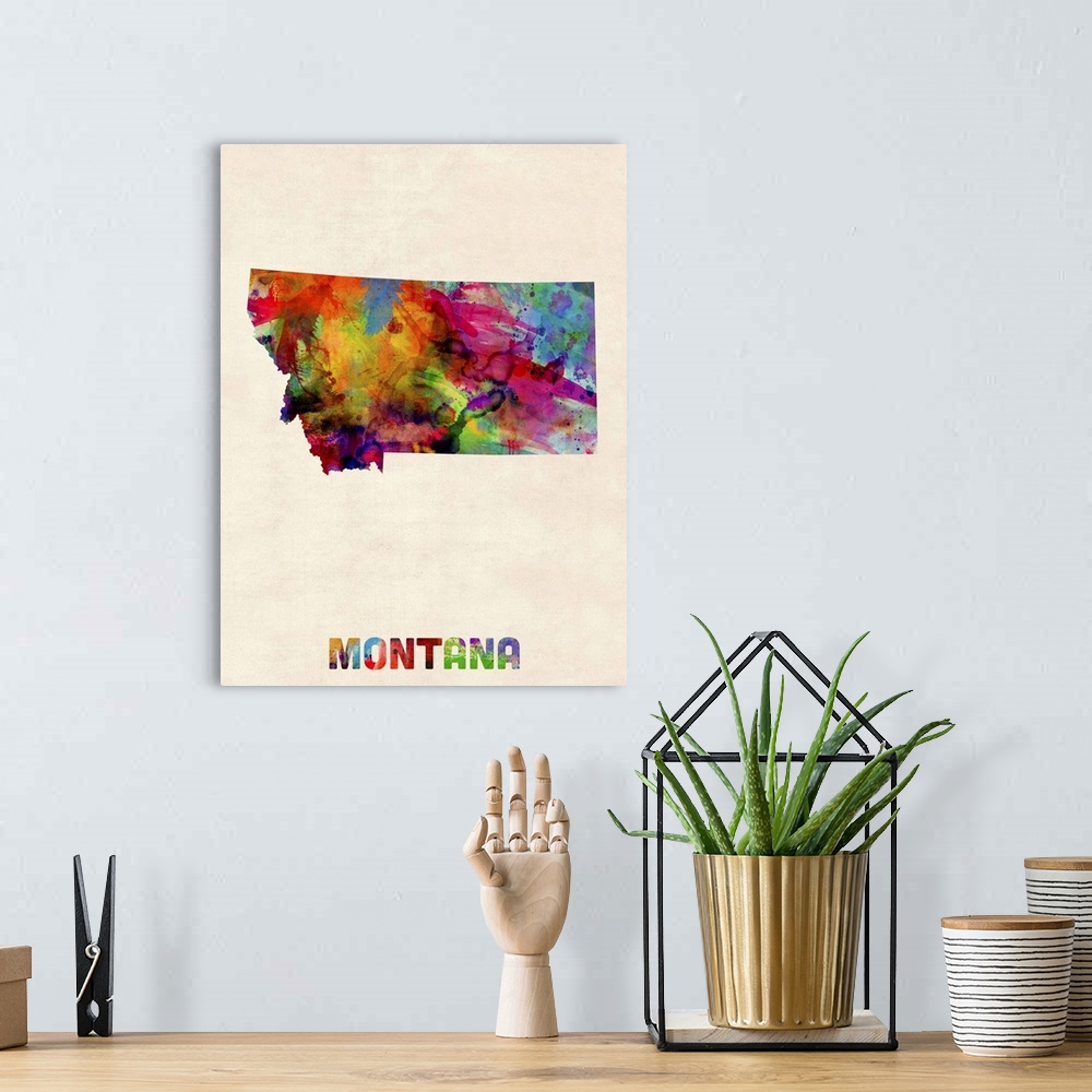 A bohemian room featuring Contemporary piece of artwork of a map of Montana made up of watercolor splashes.