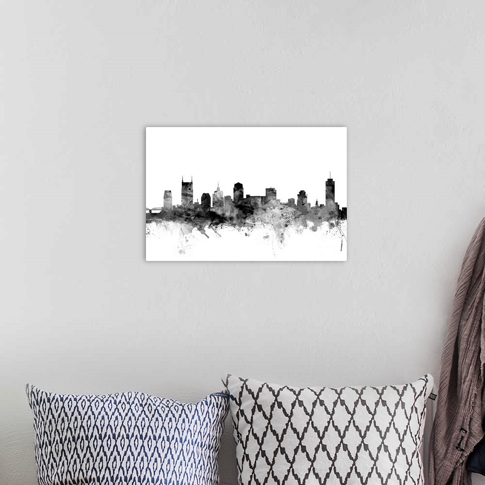 A bohemian room featuring Contemporary artwork of the Nashville city skyline in black watercolor paint splashes.