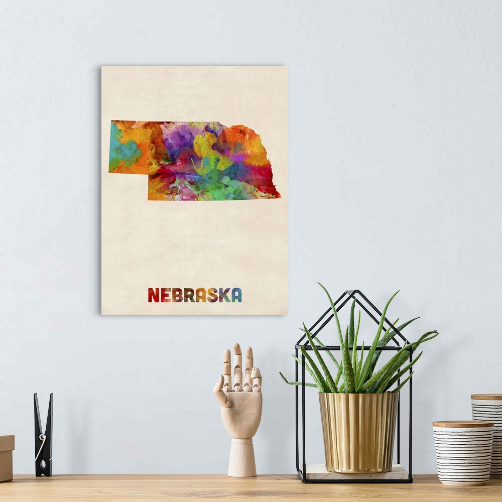 A bohemian room featuring Contemporary piece of artwork of a map of Nebraska made up of watercolor splashes.