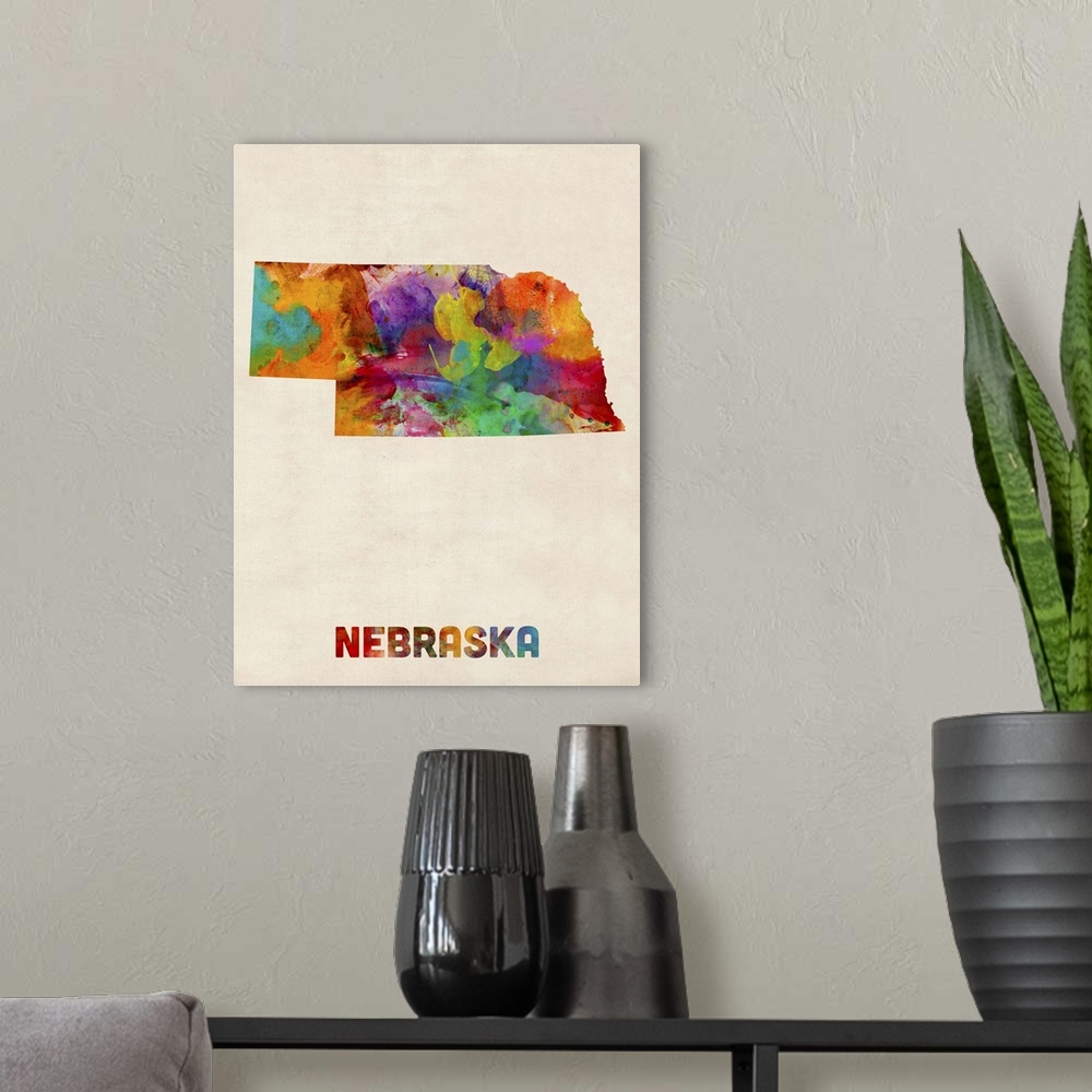 A modern room featuring Contemporary piece of artwork of a map of Nebraska made up of watercolor splashes.
