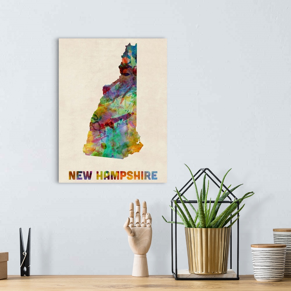 A bohemian room featuring Contemporary piece of artwork of a map of New Hampshire made up of watercolor splashes.