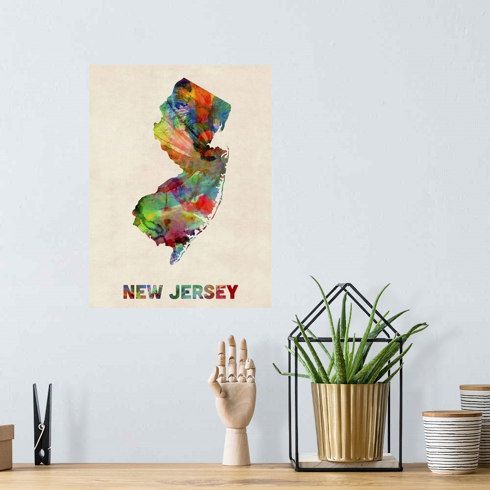 A bohemian room featuring Contemporary piece of artwork of a map of New Jersey made up of watercolor splashes.
