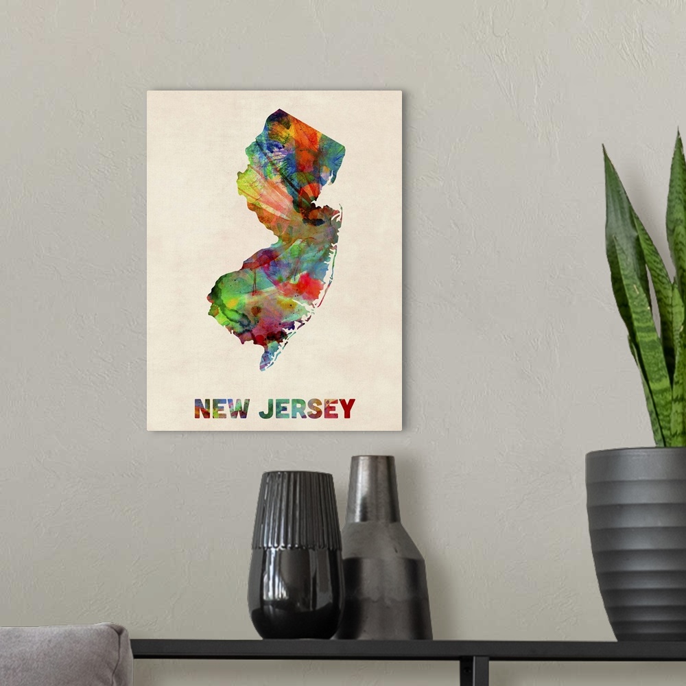 A modern room featuring Contemporary piece of artwork of a map of New Jersey made up of watercolor splashes.