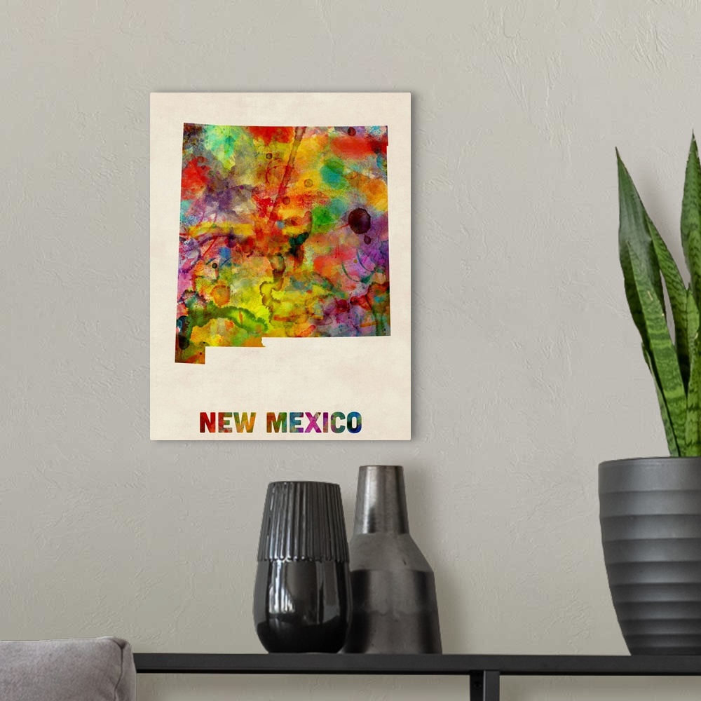 A modern room featuring Contemporary piece of artwork of a map of New Mexico made up of watercolor splashes.